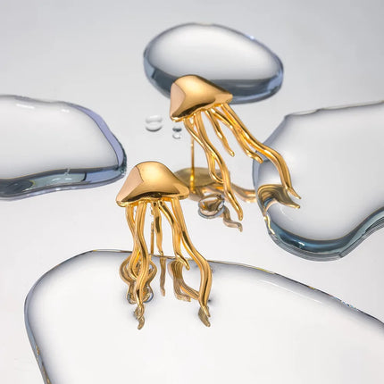 Pendientes de botón con forma de medusa en color oro de 18 quilates