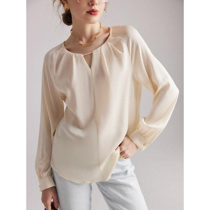 Blusa elegante de mezcla de seda con mangas raglán