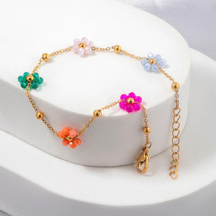 Bracelet en acier inoxydable avec perles et fleurs colorées