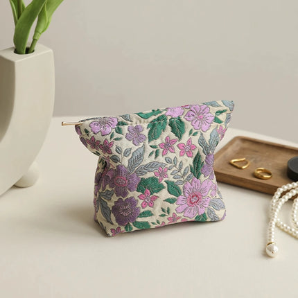 Bolsa de cosméticos vintage con diseño floral