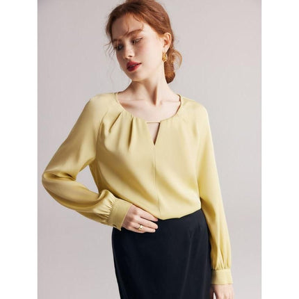 Blusa elegante de mezcla de seda con mangas raglán