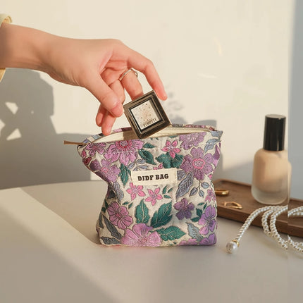 Bolsa de cosméticos vintage con diseño floral