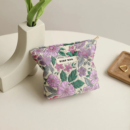 Bolsa de cosméticos vintage con diseño floral