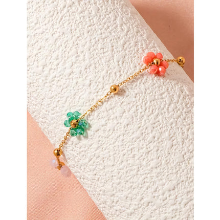 Bracelet en acier inoxydable avec perles et fleurs colorées