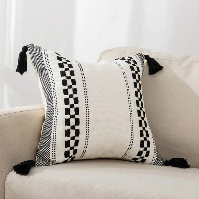 Housse de coussin élégante noire et blanche 18x18 avec pompons tissés