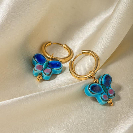 Pendientes de botón de cerámica con forma de mariposa y flor azul de acero inoxidable bañados en oro de 18 quilates