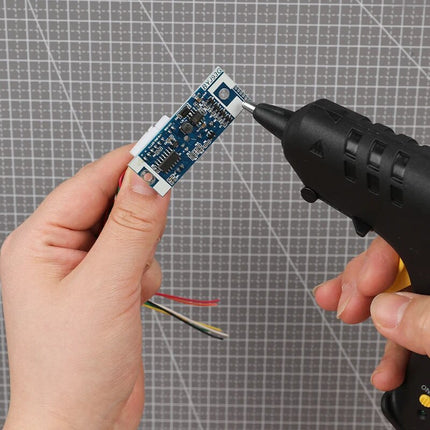 Pistola de pegamento termofusible para barras de 7 mm