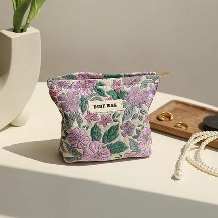 Bolsa de cosméticos vintage con diseño floral