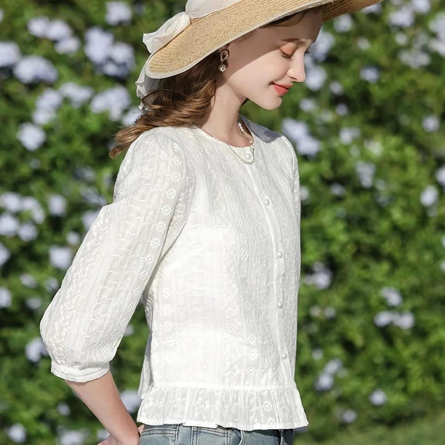 Elegante blusa de algodón blanca con mangas abullonadas estilo francés