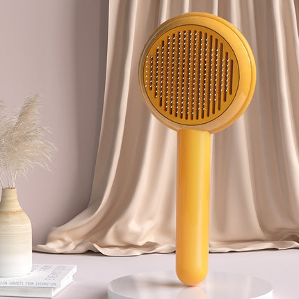 Brosse de toilettage autonettoyante pour chiens et chats