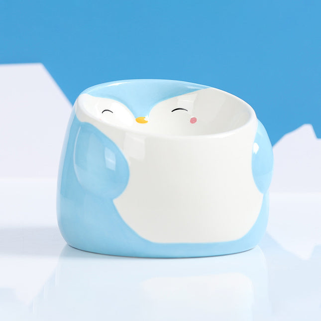 Cuenco elevado de cerámica para mascotas con forma de pingüino