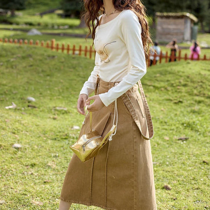 Falda elegante de algodón con tirantes y cintura alta en forma de A