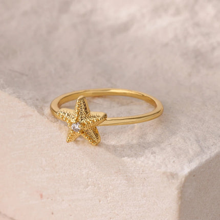 Anillo de estrella de mar con circonitas para mujer