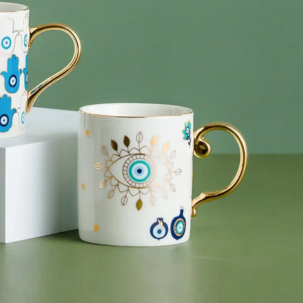 Taza de café de cerámica de lujo con forma de ojo de diablo bañada en oro