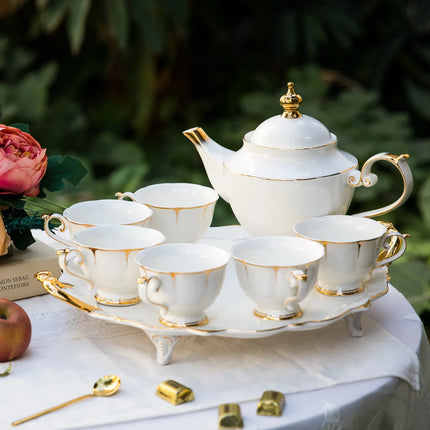 Juego de té de porcelana china con incrustaciones de oro real