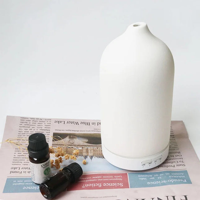 Diffuseur d'huiles essentielles à ultrasons en céramique avec minuterie et veilleuse